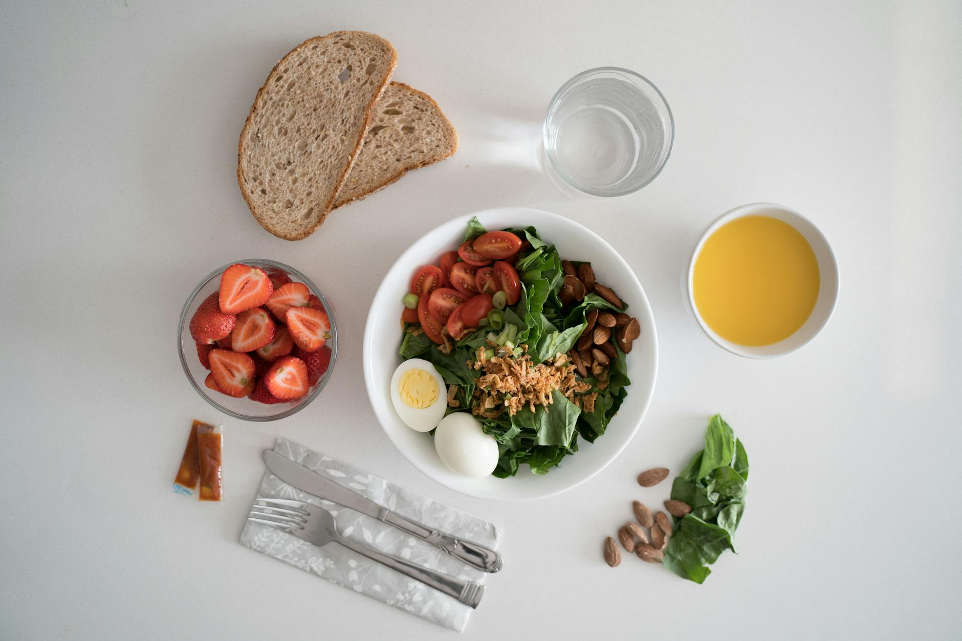 Anatomical illustration overlaid on a balanced meal with eggs, salmon, leafy greens, and fresh fruit on a kitchen counter