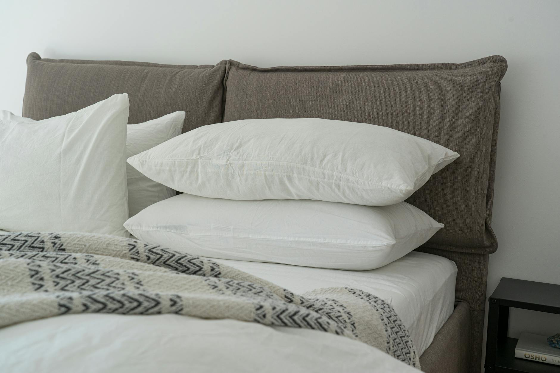 Person sleeping peacefully in a calm bedroom with a balanced meal and herbal tea on the nightstand
