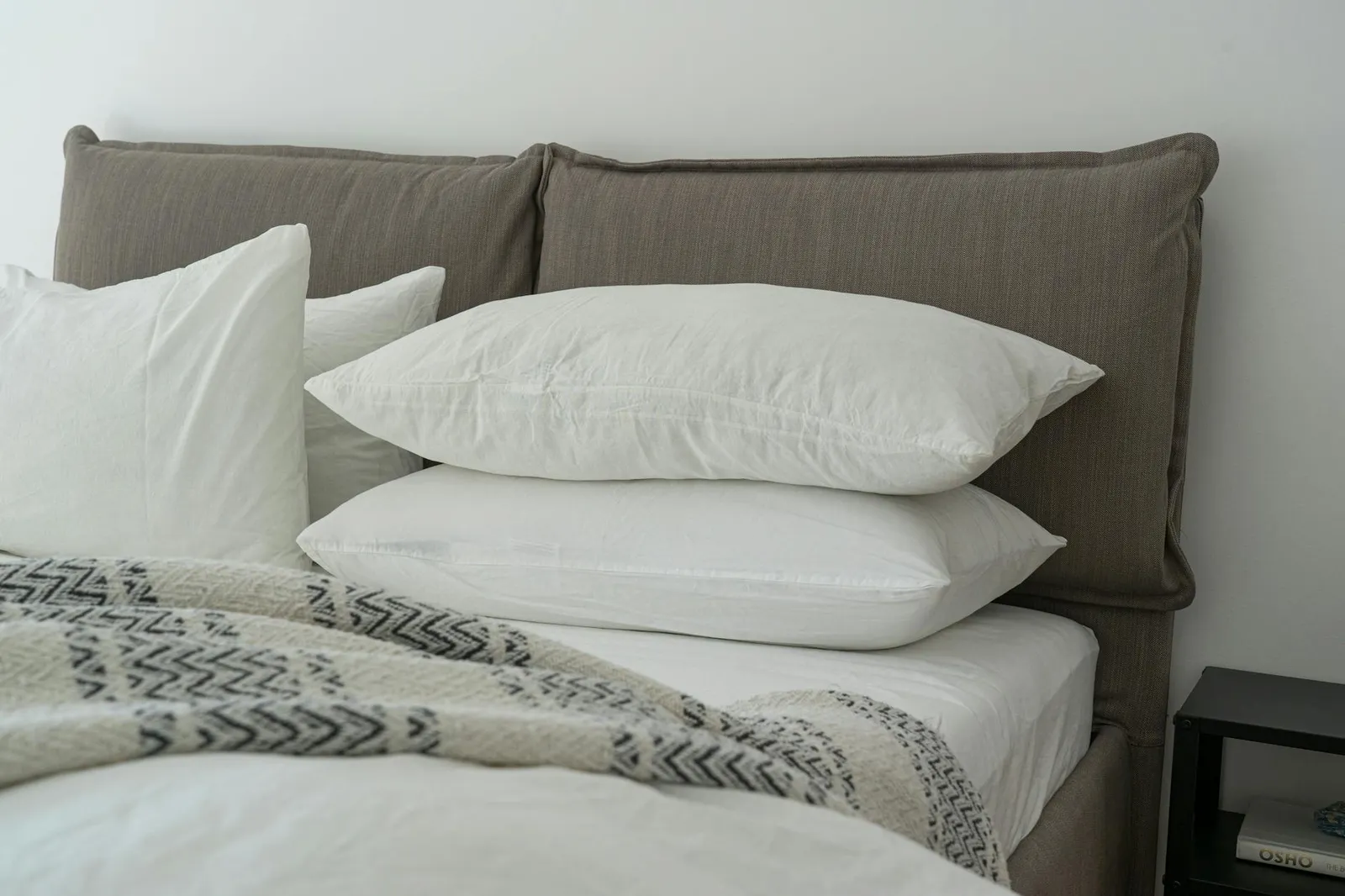 Person sleeping peacefully in a calm bedroom with a balanced meal and herbal tea on the nightstand