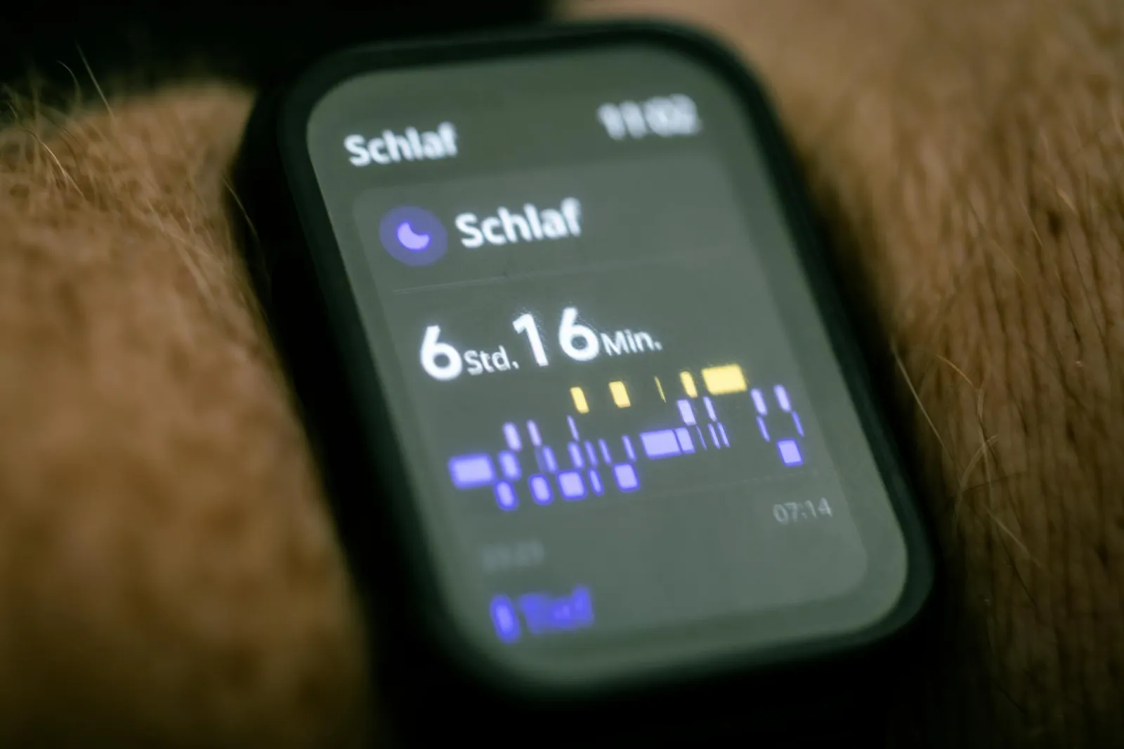 Person checking sleep data on a smartwatch in the morning next to a nutritious breakfast with oatmeal fruit and coffee